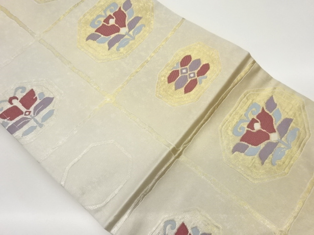 格子に抽象華文模様織出し名古屋帯